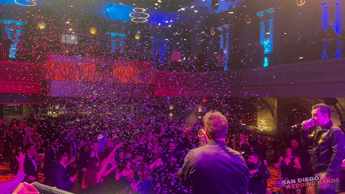 Shades of Blue With Large Wedding Crowd and Confetti
